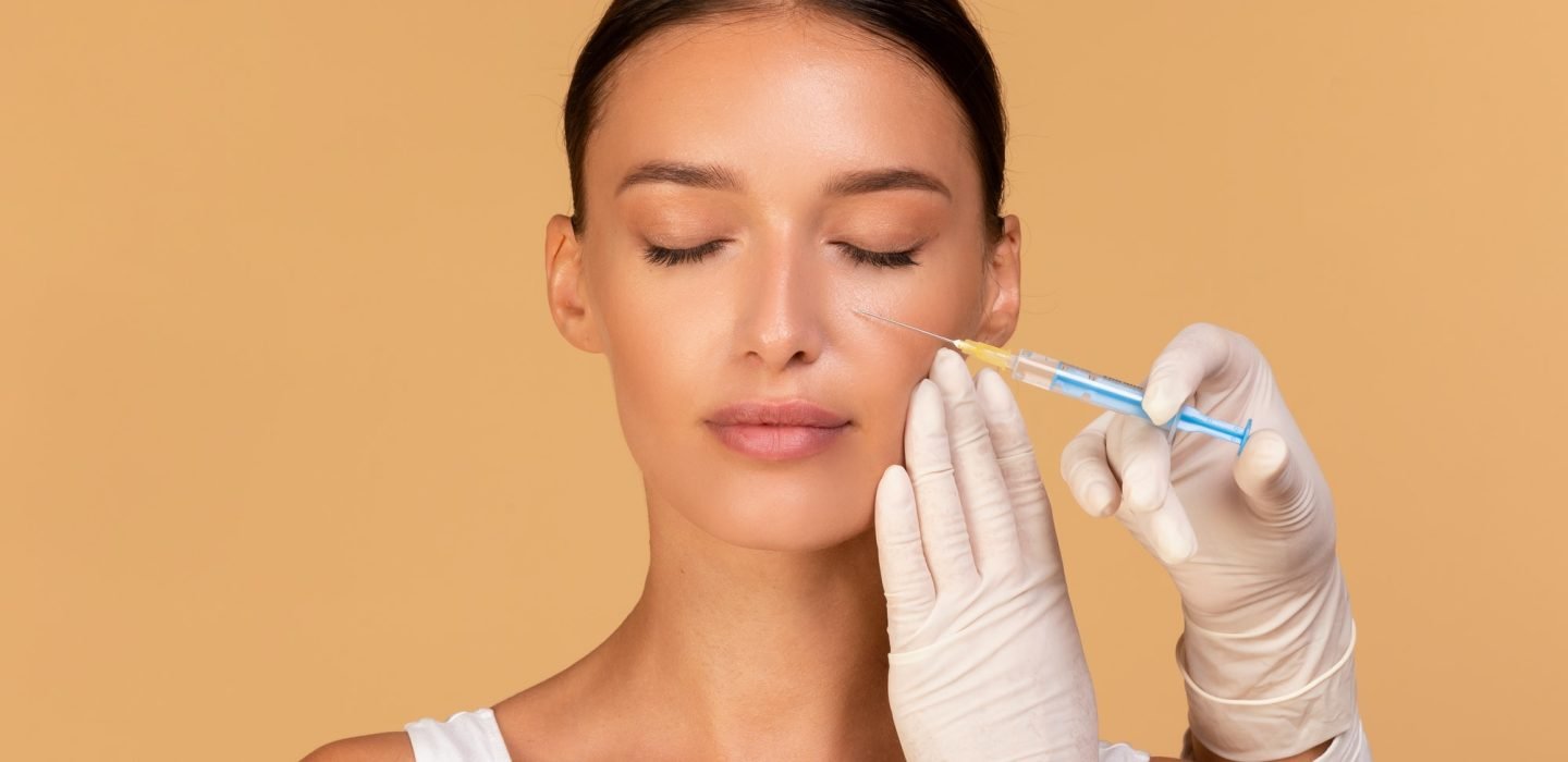 plastic-surgery-and-beauty-injection-concept-attractive-young-woman-receiving-botox-for-wrinkles.jpg